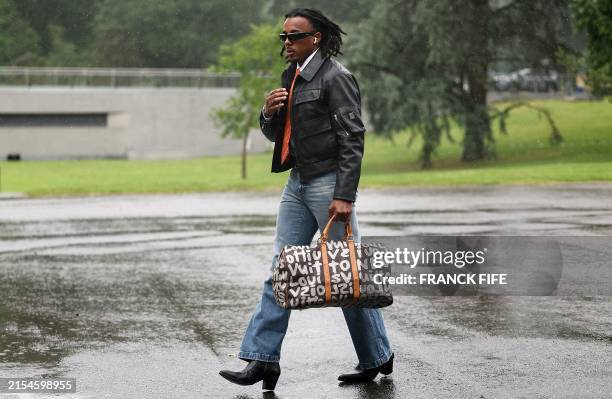 France's defender Jules Kounde arrives to the national team's training camp for the upcoming UEFA Euro 2024 European Football Championship, in...