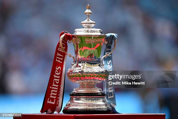 Detailed view as the FA Cup Trophy is displayed on a plinth prior to the Emirates FA Cup Final match between Manchester City and Manchester United at...