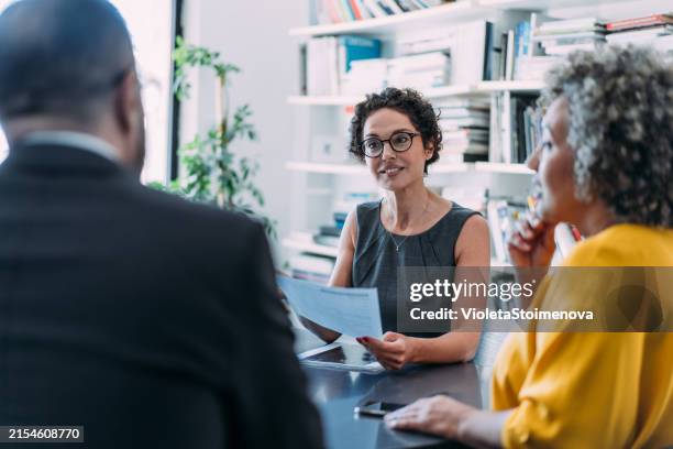 group of business persons talking in the office. - professione giuridica foto e immagini stock