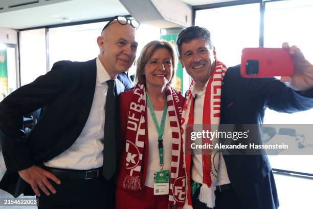 Bernd Neuendorf, President of the German Football Association, Rhineland-Palatinate Premier Malu Dreyer and former referee Dr. Markus Merk pose for a...