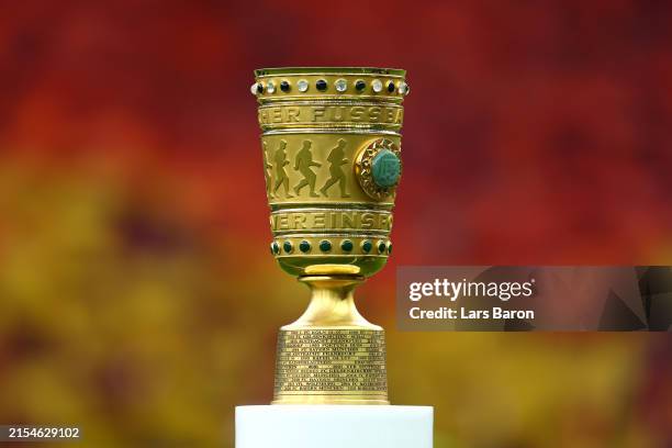 Detailed view of the DFB Cup Trophy is displayed on a plinth prior to the DFB Cup 2023/24 final match between 1. FC Kaiserslautern and Bayer 04...