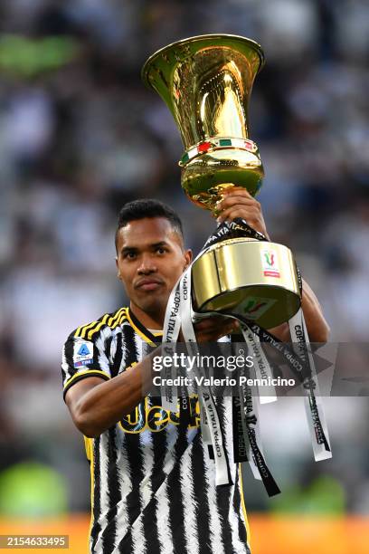 Alex Sandro of Juventus celebrates with the Coppa Italia Trophy during the Serie A TIM match between Juventus and AC Monza at on May 25, 2024 in...