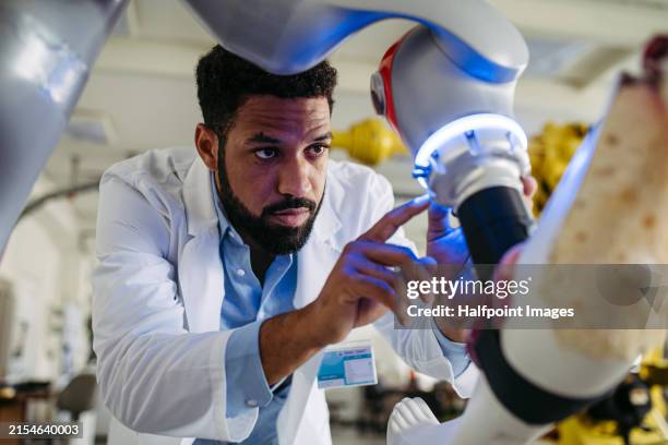 robotic engineer working on robotic knee replacement surgery project. concept of robotics, engineering and computer science in healthcare. - health technology stock pictures, royalty-free photos & images