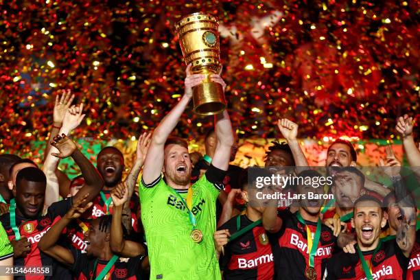 Lukas Hradecky of Bayer 04 Leverkusen lifts the DFB-Pokal Trophy after his team's victory in the DFB Cup 2023/24 final match between 1. FC...