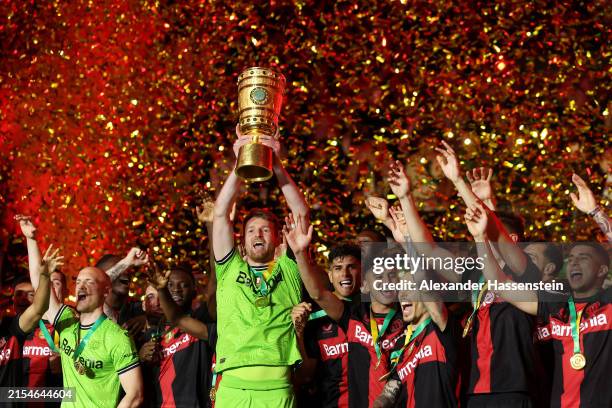 Lukas Hradecky of Bayer 04 Leverkusen lifts the DFB-Pokal Trophy after his team's victory in the DFB Cup 2023/24 final match between 1. FC...
