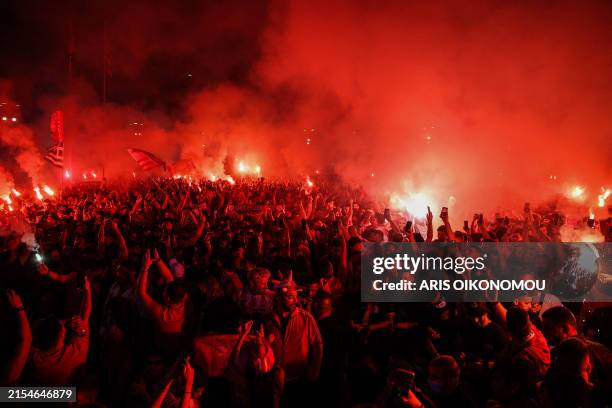 Supporters of Olympiakos FC gather at the Fan Festival in Piraeus to watch the UEFA Europa Conference League final football match between Olympiakos...