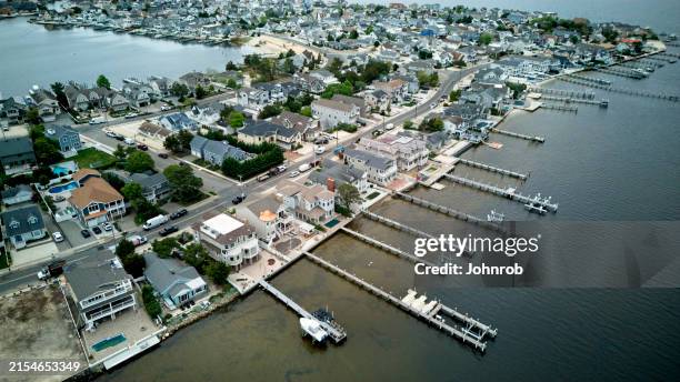 bayside community summer homes with boat docks - new jersey stock pictures, royalty-free photos & images