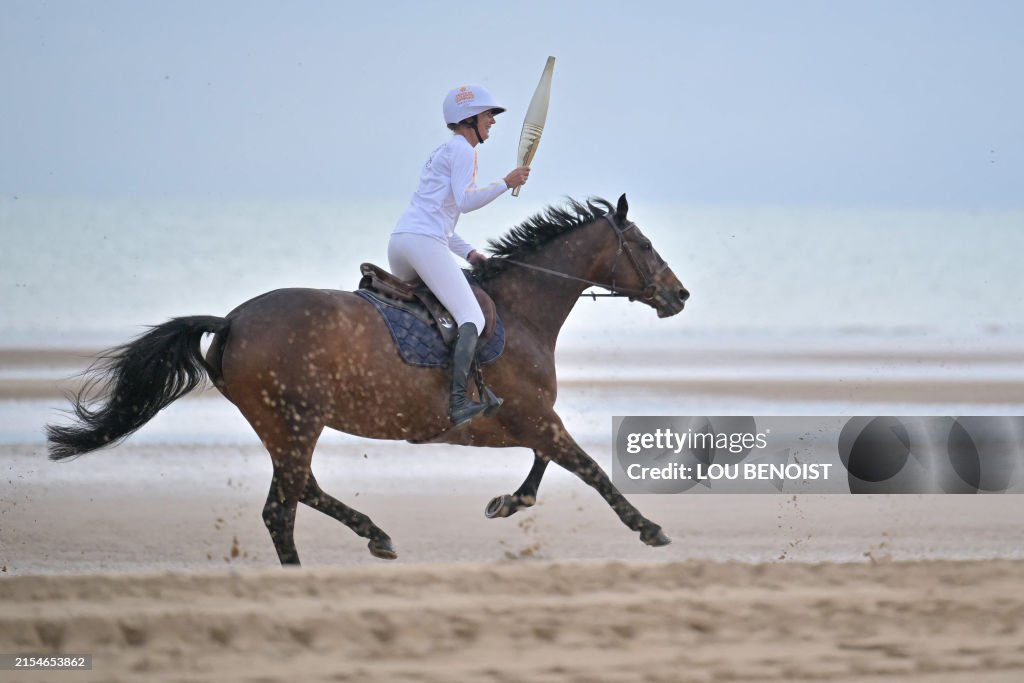 TOPSHOT-FRANCE-PARIS-OLY-2024-TORCH