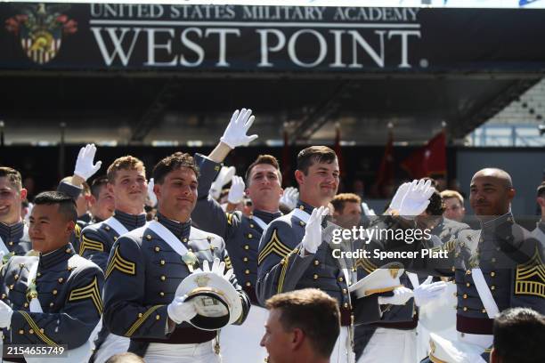 Cadets wave to their families during the West Point commencement exercises for the Class of 2024 at Michie Stadium on May 25, 2024 in West Point, New...