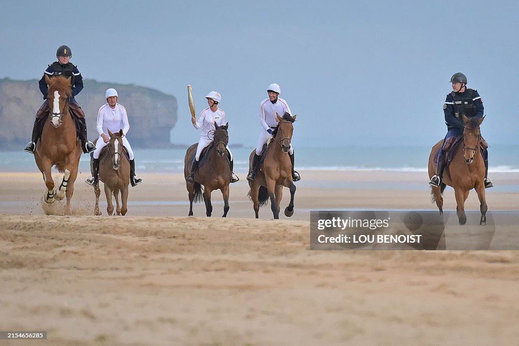 TOPSHOT-FRANCE-PARIS-OLY-2024-TORCH