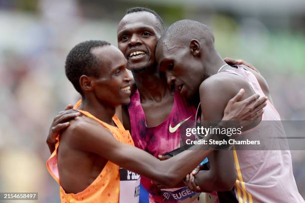 Daniel Mateiko of Team Kenya wins the men's 10,000 meter run surrounded by Elkanah Kibet of Team Ken, left, and Nicholas Kipkorir of Team Kenya...