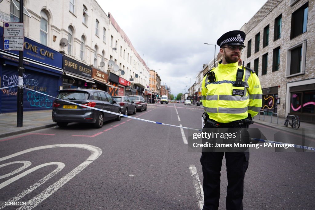 Police Hackney Police officer at the scene of a shooting at Kingsland High Street ...