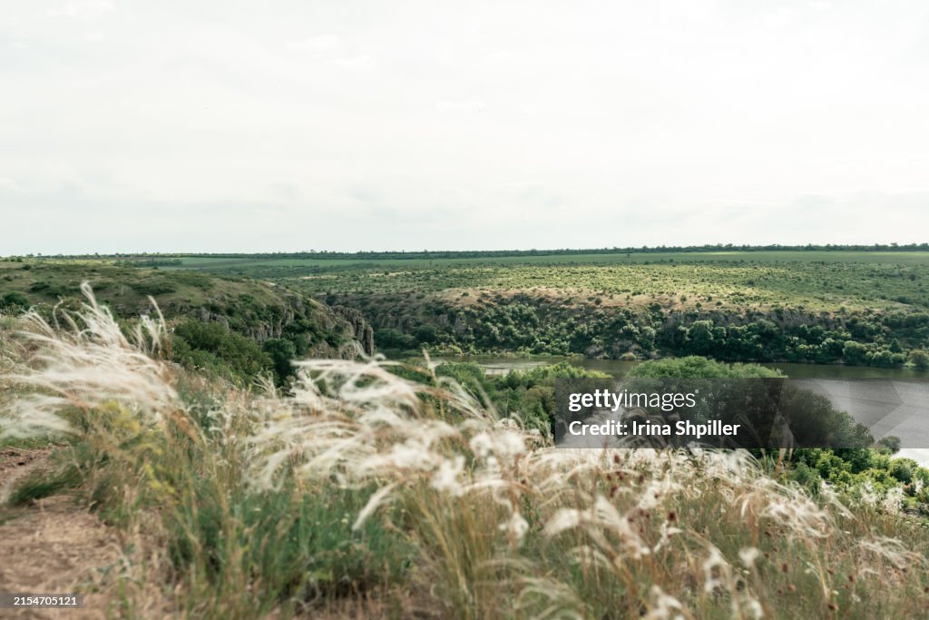 Beautiful natural scenery of river in Ukraine with rocks in background, top view. Summer time.
