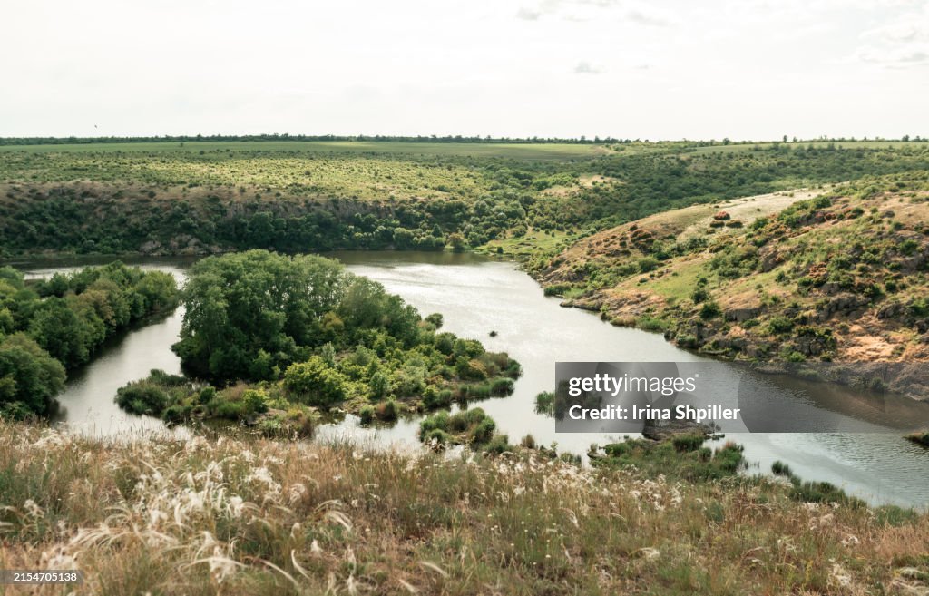 Beautiful natural scenery of river in Ukraine with rocks in background, top view. Summer time.
