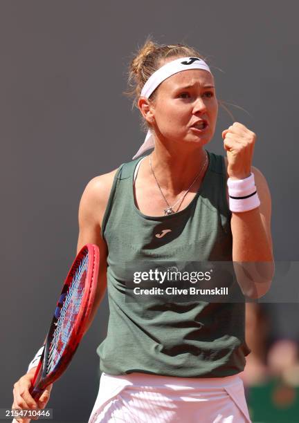 Marie Bouzkova of the Czech Republic celebrates a point against Veronika Kudermetova during the Women's Singles first round match on Day One of the...