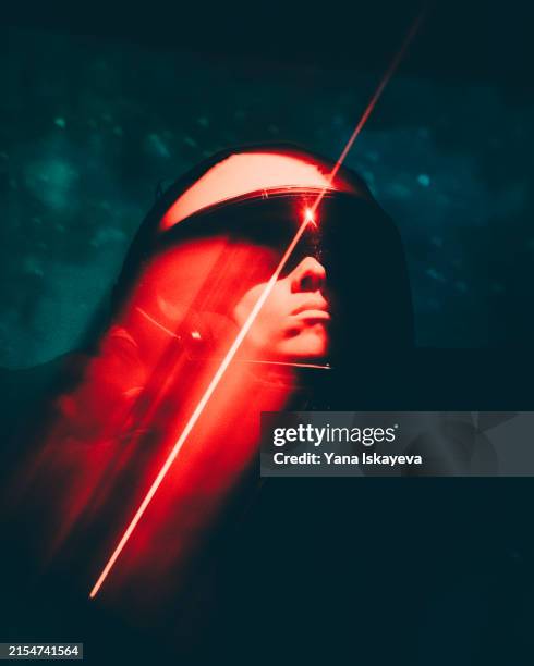 a futuristic portrait of an intergalactic astronaut exploring outer space to find the new habitat - casco espacial fotografías e imágenes de stock
