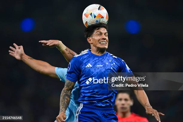 Lucas Romero of Cruzeiro and Luciano Nieto of Universidad Catolica fight for the ball during a Copa CONMEBOL Sudamericana 2024 match between Cruzeiro...