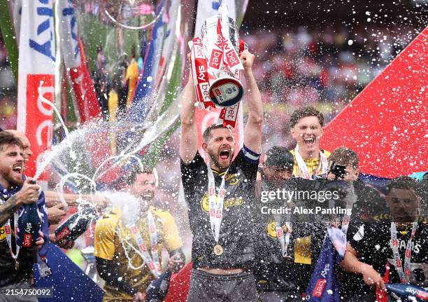 Jack Stephens of Southampton lifts the Sky Bet Championship Play-Off Final Trophy after his team's victory, after Southampton secure promotion to the...