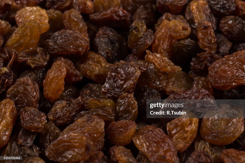 Sweet dry raisins close up shot for background