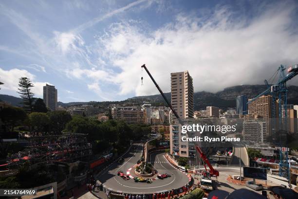 Charles Leclerc of Monaco driving the Ferrari SF-24 leads Oscar Piastri of Australia driving the McLaren MCL38 Mercedes, Carlos Sainz of Spain...