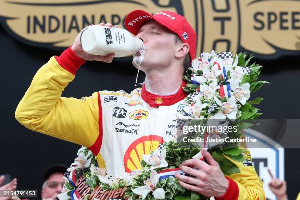 Josef Newgarden, driver of the Shell Powering Progress Team Penske, celebrates in Victory Circle after winning the 108th Running of the Indianapolis...