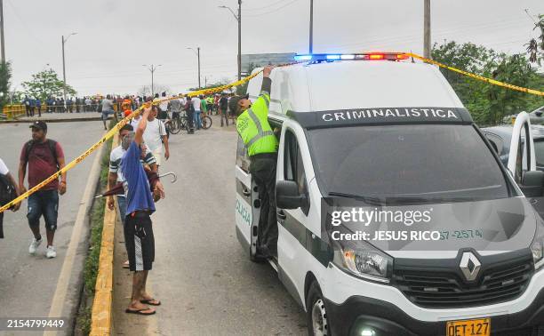 Police van leaves the scene of the collapse of a bridge in Soledad, next to Barranquilla, Colombia on May 31, 2024. A vehicle bridge collapsed in...