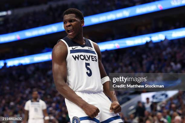 Anthony Edwards of the Minnesota Timberwolves reacts after a dunk against the Dallas Mavericks during the third quarter in Game Three of the Western...