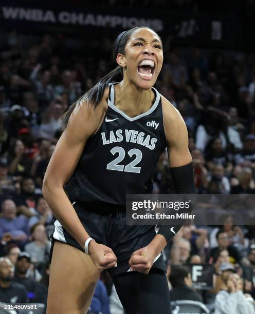 Ja Wilson of the Las Vegas Aces reacts after making a basket and drawing a foul against the Indiana Fever in the third quarter of their game at...