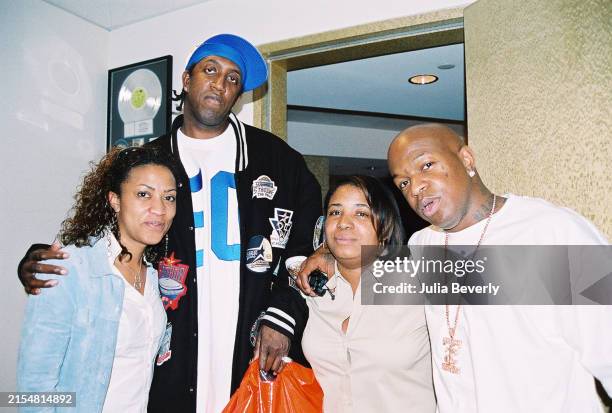 Cash Money Records CEOs Ronald "Slim" Williams and Bryan "Birdman" Williams with publicists Wendy Washington and Vickie Charles at the Universal...