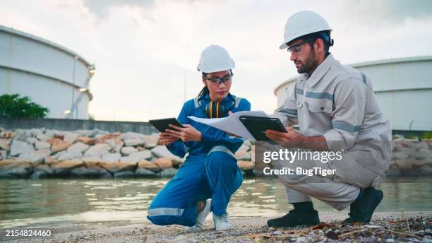 examining the ecosystem around industrial plants. - chemical plant stock pictures, royalty-free photos & images
