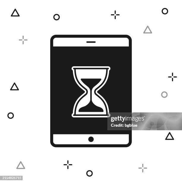 tablet pc with hourglass. icon on white background - computer loading stock illustrations