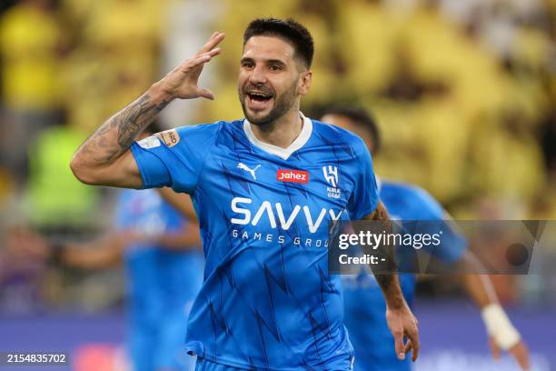 Hilal's Serbian forward Aleksandar Mitrovic celebrates scoring his team's first goal during the King's Cup final match between Al-Nassr and Al-Hilal...