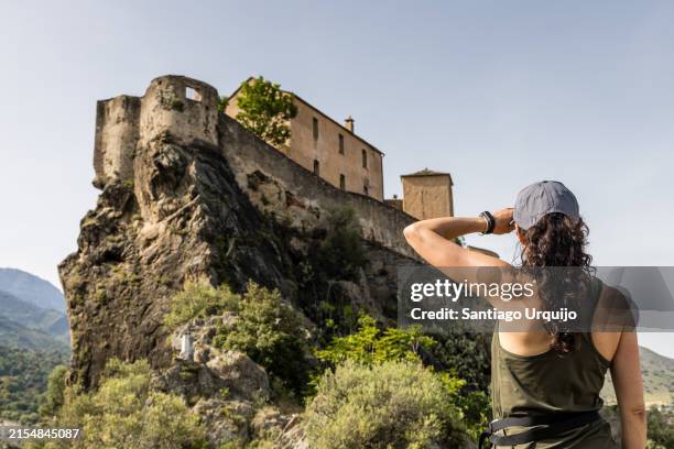 woman looking at the citadel of corte - historia social fotografías e imágenes de stock