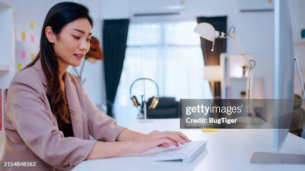 business woman sitting and working at modern office. - publisher stock pictures, royalty-free photos & images