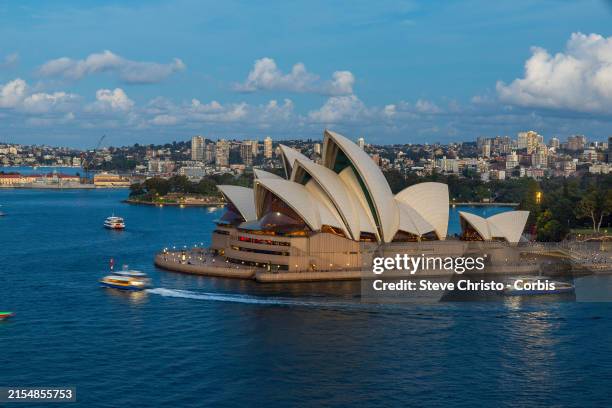 The moon rises over the Sydney Opera House before the fireworks signal the start of Vivid on May 24, 2024 in Sydney, Australia. Vivid Sydney is an...
