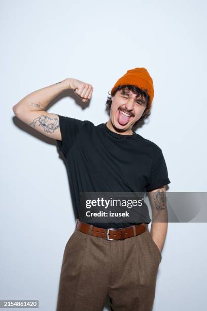 portrait of playful young man - bigote fotografías e imágenes de stock