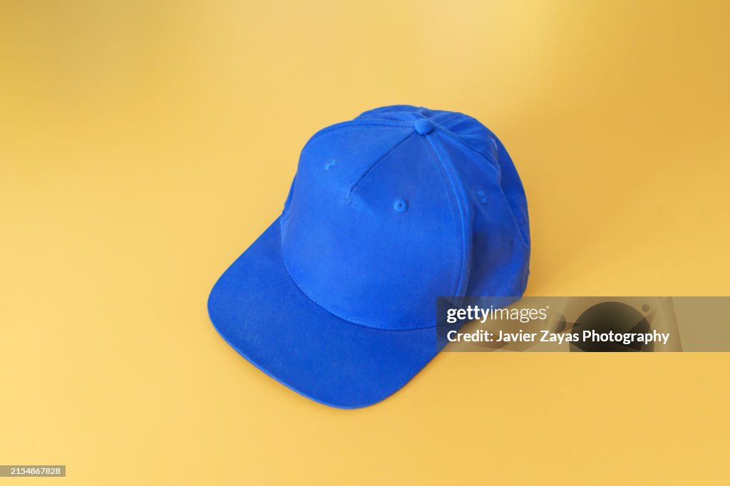 Blue Baseball Cap Isolated on Yellow background