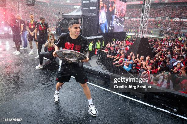 Gustavo Puerta of Leverkusen presenting the Meisterschale to the fans during the Bayer 04 Leverkusen champions party on May 26, 2024 in Leverkusen,...