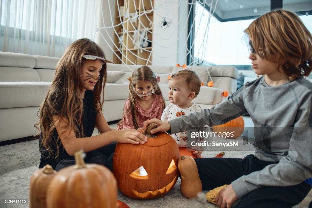A group of children playing hocus pocus on a Halloween day