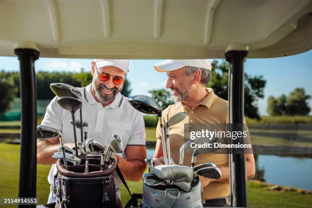 two golfers getting ready for a game - hot male golfers stock pictures, royalty-free photos & images