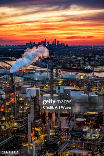 houston's skyline beyond refineries at dusk - pipe ship stock pictures, royalty-free photos & images