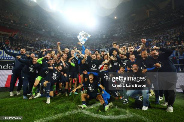 Players of VfL Bochum celebrate following the team's victory and securing a spot in Bundesliga after the Bundesliga playoffs second leg match between...