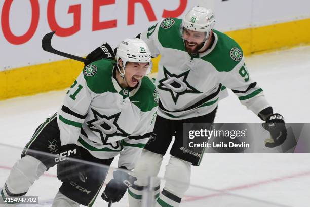 Jason Robertson of the Dallas Stars celebrates after his third goal with Tyler Seguin of the Dallas Stars during the third period in Game Three of...