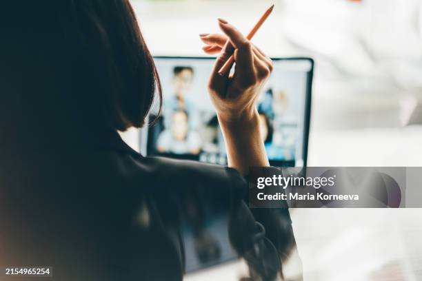 young working woman talking on video call via laptop. - zoom classroom stock pictures, royalty-free photos & images