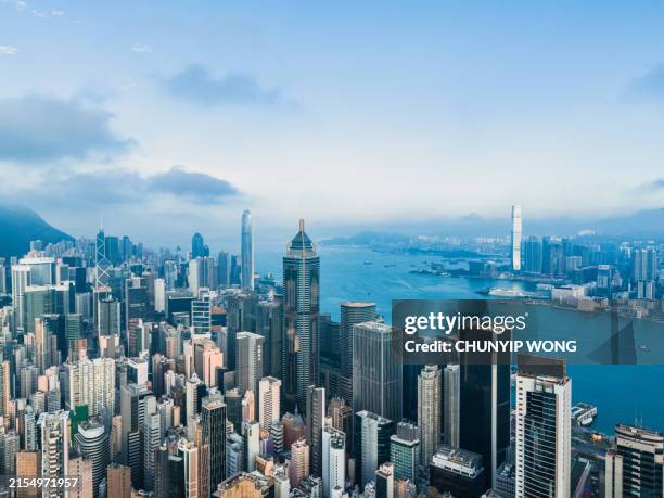 hong kong viewed from the drone with city skyline of crowded skyscrapers - hong kong stock pictures, royalty-free photos & images