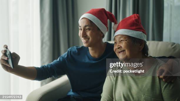 family taking a selfie at christmas day. - family webcam stock pictures, royalty-free photos & images