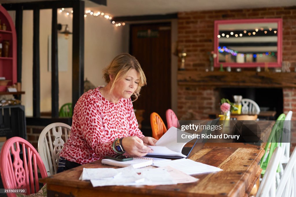 Cafe owner doing her paperwork