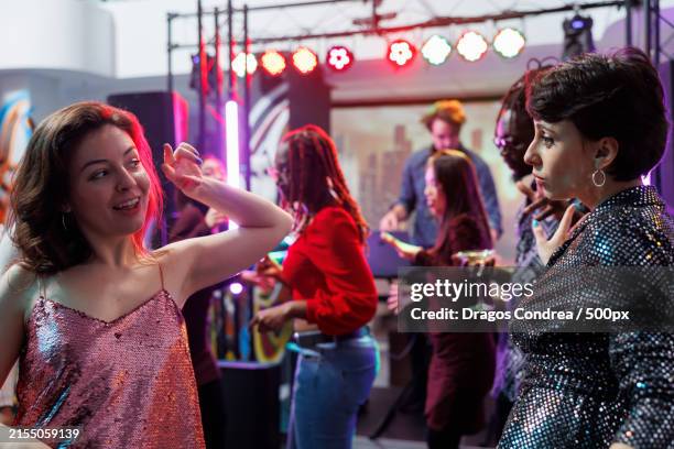 couple dancing together while partying at club - white people dancing photos et images de collection