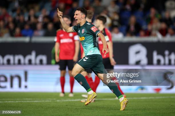 Konrad Faber of SSV Jahn Regensburg celebrates scoring his team's second goal during the Second Bundesliga playoffs second leg match between Wehen...