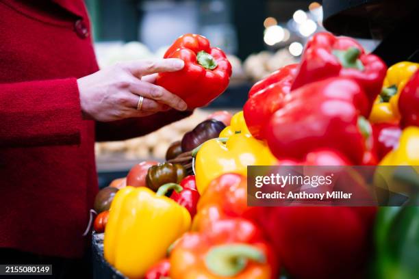 farmer's market: focus on hands and peppers - red bell pepper stock pictures, royalty-free photos & images